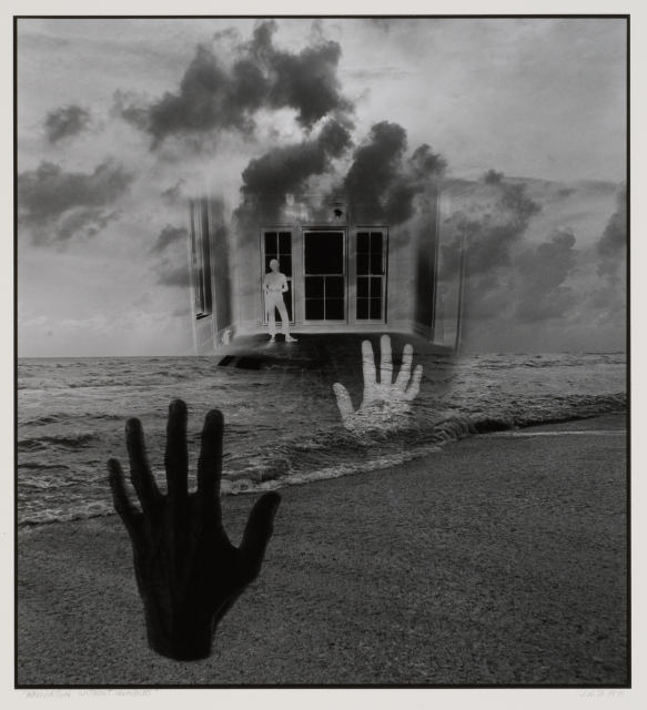 In this surreal scene, two hands are floating over a beach (one emerging from the water), and a floating interior scene with a figure standing in it hangs over the water at the horizon line. Clouds are superimposed over and behind the floating interior scene.