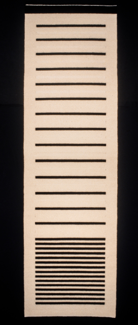 A tall white rectangle with thin black horizontal lines which begin at the base very close together at a regular distance and then become much wider at a regular distance.