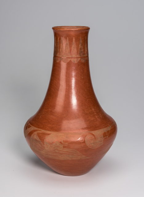 A red clay jar with a wide, rounded base that tapers upward in a long, cylindrical neck ending in a slightly flaring mouth. There is a serpent motif on the lower third of the jar.